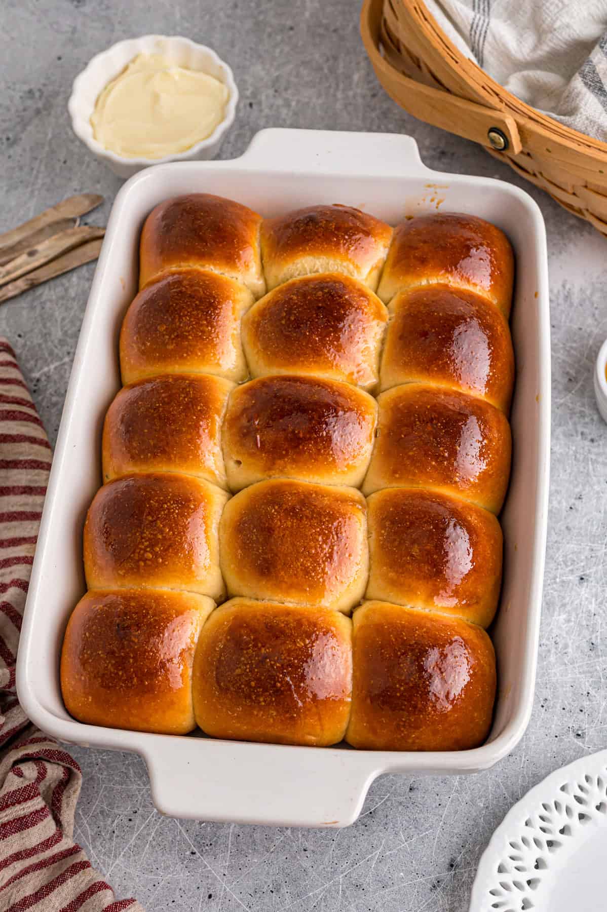 This Hawaiian Rolls recipe makes soft, fluffy rolls that taste just like the store-bought version – maybe even better. Homemade Hawaiian rolls in a baking dish