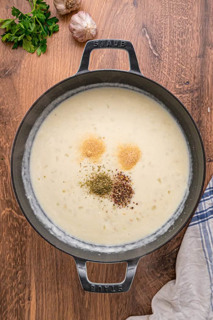 A creamy mixture of veggies and chicken is topped with a flaky, buttery topping in this Puff Pastry Chicken Pot Pie Recipe. Spices added to heavy cream and broth in a pot