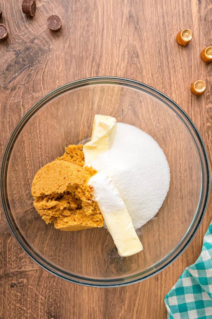 White sugar, brown sugar, and butter in a bowl
