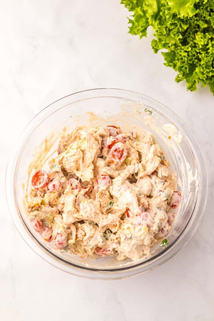 Full of tender chicken, crispy bacon, and tomatoes tossed in a creamy dressing, this BLT Chicken Salad is ready in just 5 minutes. Chicken salad filling in a bowl