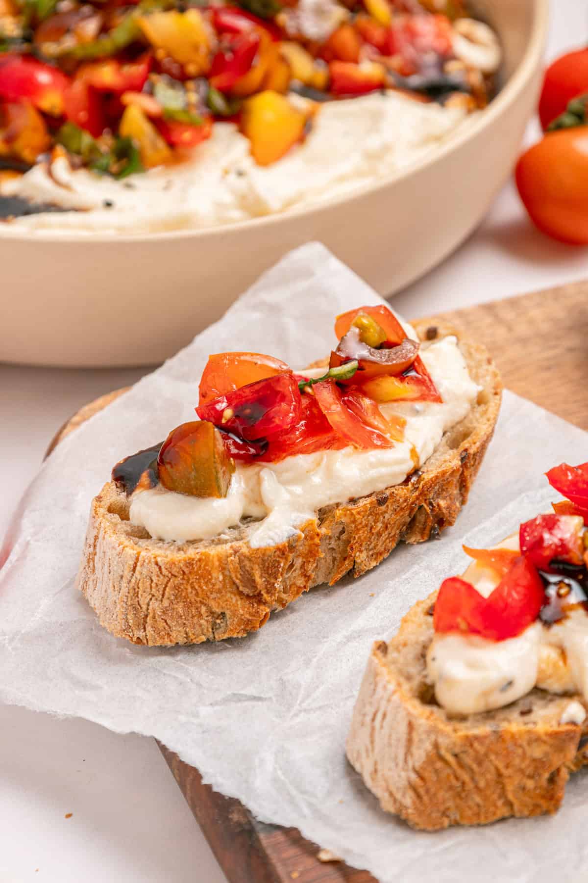 Slices of crostini topped with bruschetta dip