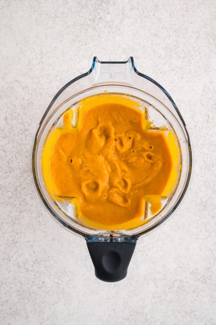 With caramelized carrots, onion, and garlic, this Roasted Carrot Soup is ready in 45 minutes. Gluten-free & vegetarian! Blended carrots in a blender