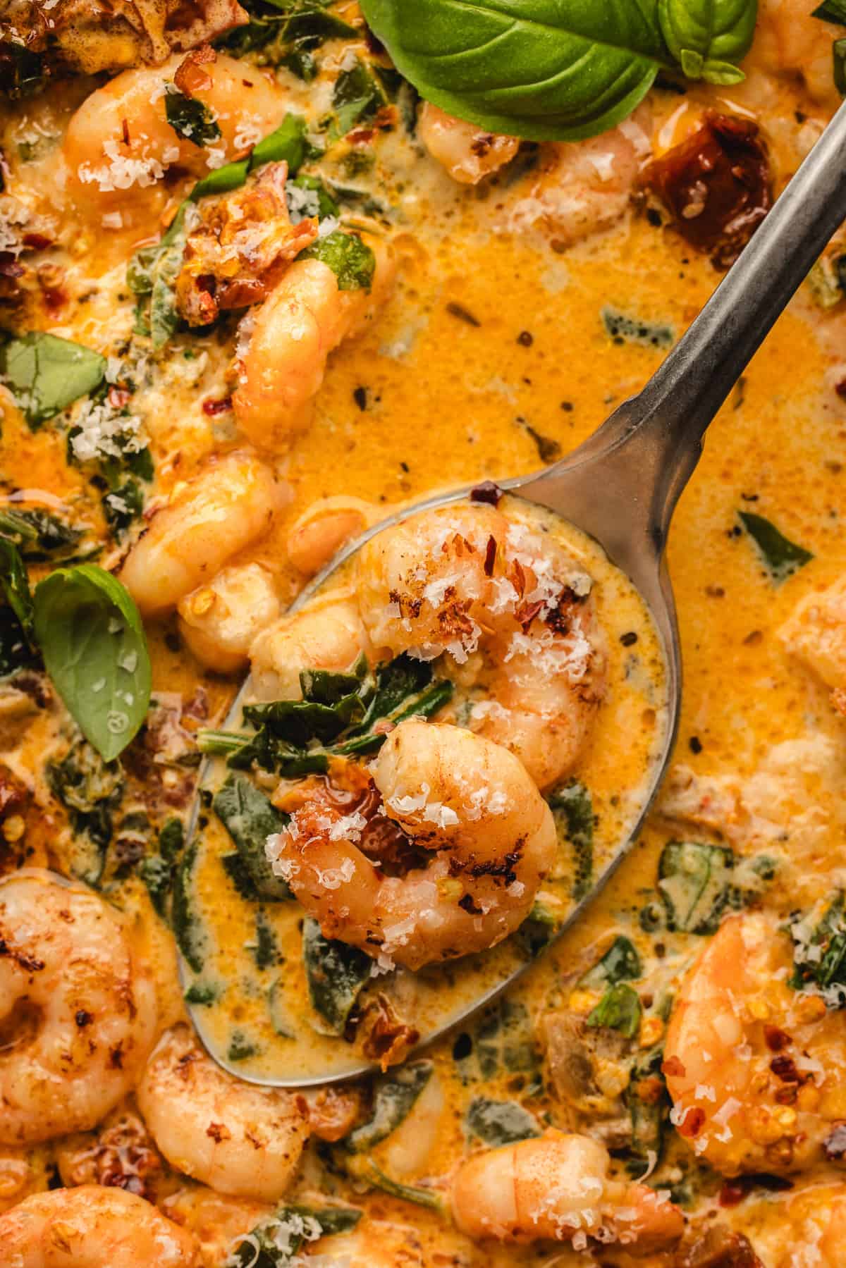 A spoon in Tuscan shrimp