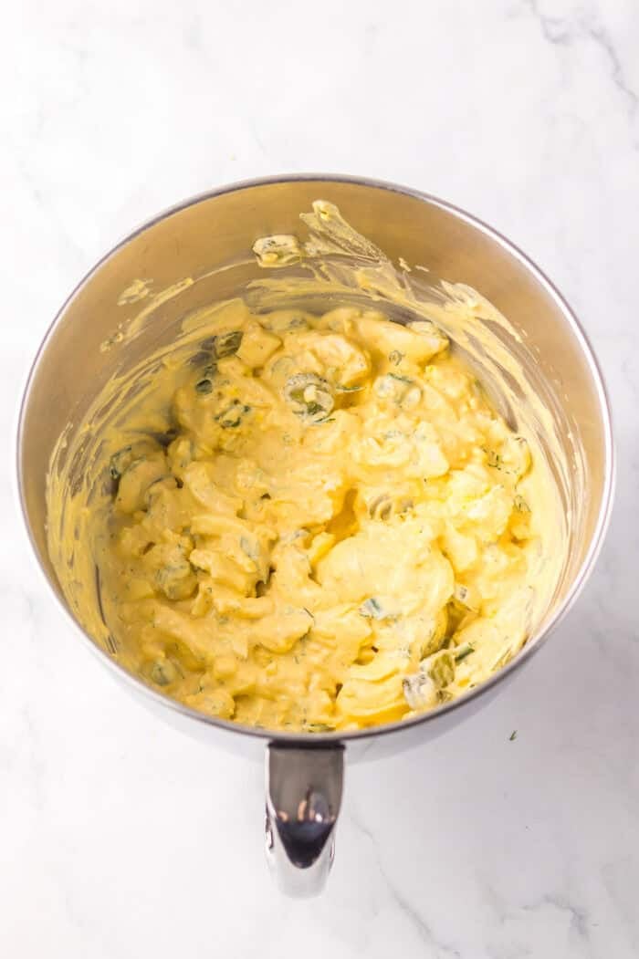 Dill pickle egg salad in a mixing bowl