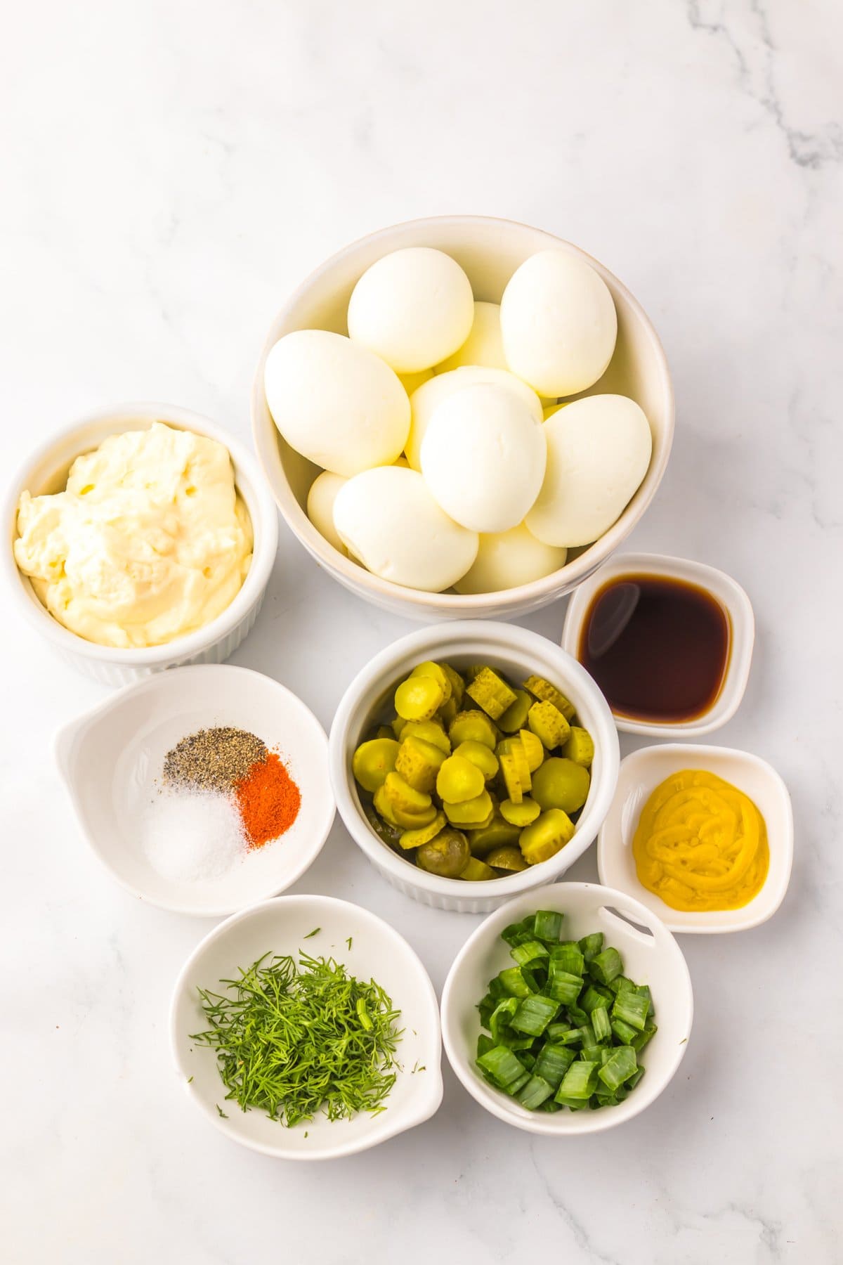Overhead view of ingredients needed to make dill pickle egg salad