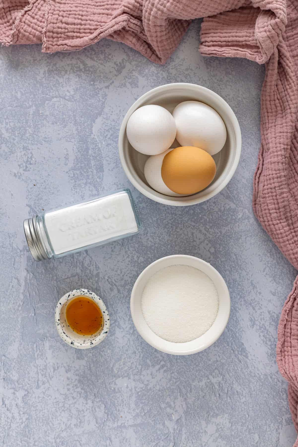 Light and fluffy just like a marshmallow, this Marshmallow Frosting recipe takes just 5 ingredients and 10 minutes to prepare. Overhead view of ingredients needed to make marshmallow frosting