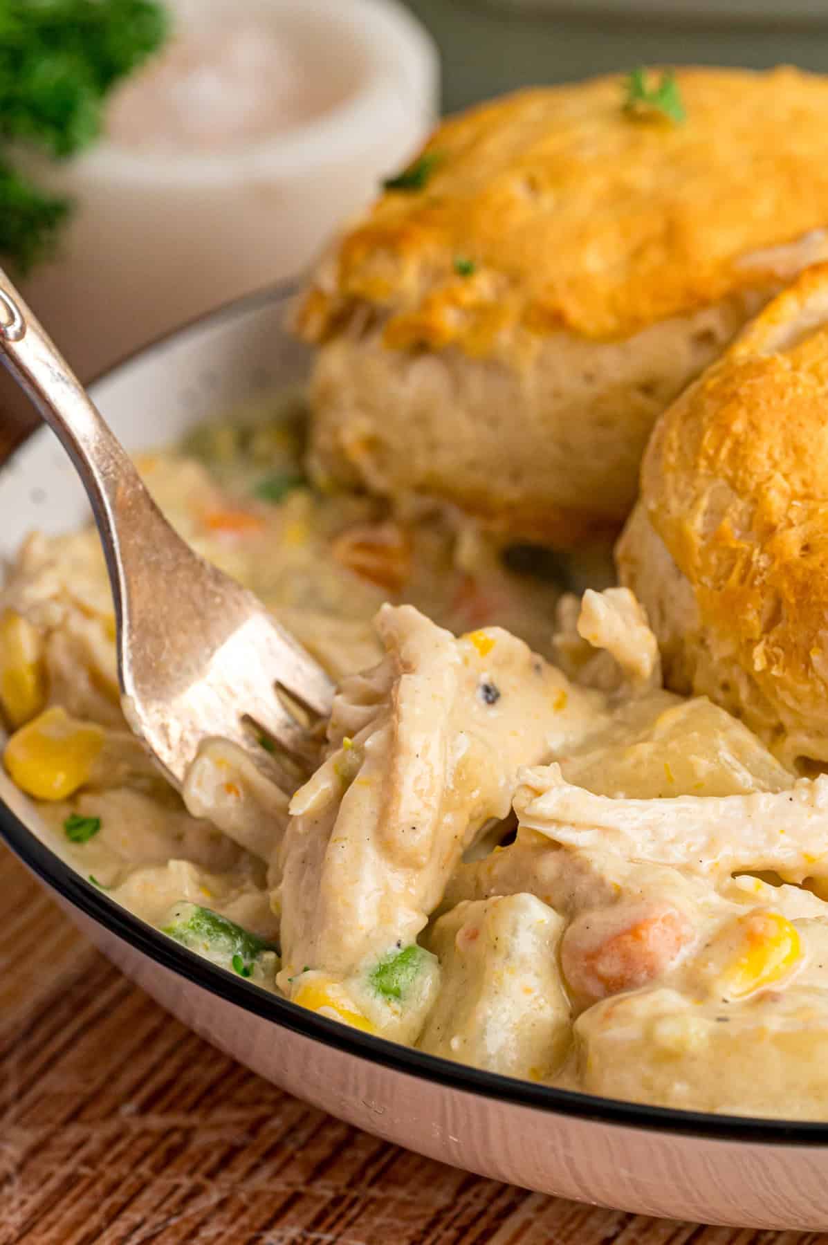 A fork in a bowl of Crockpot Chicken Pot Pie