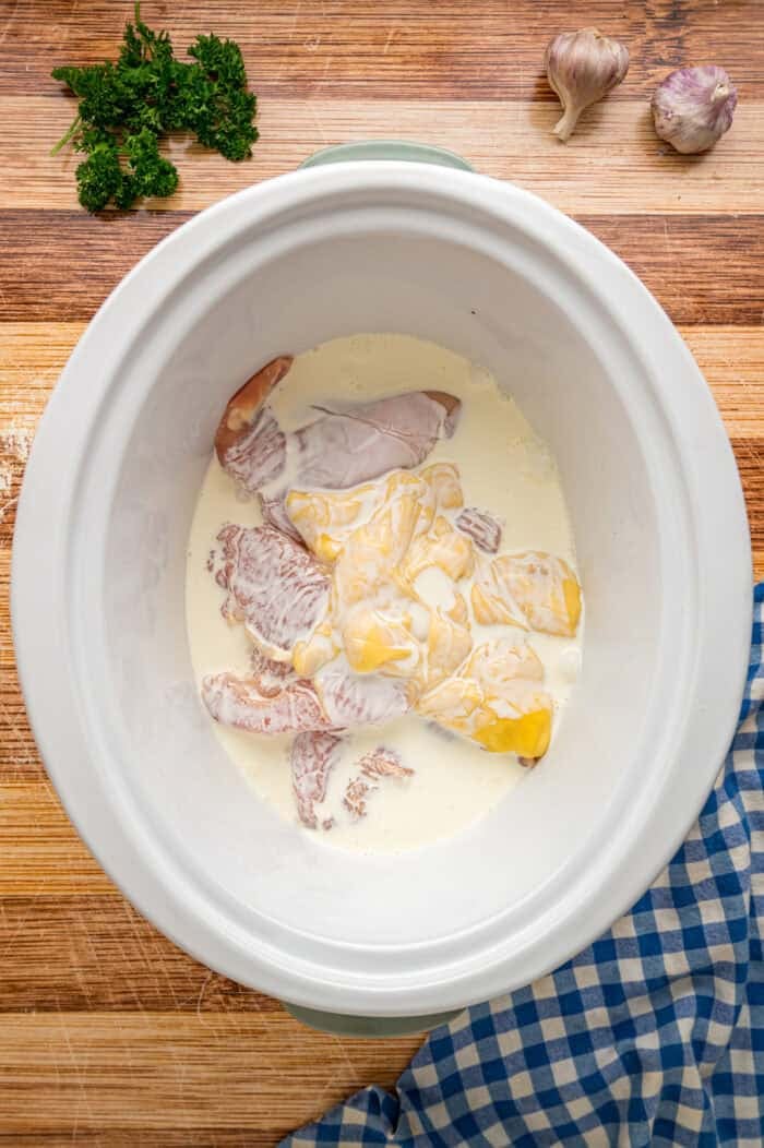 Chicken, half and half, and cream of chicken soup in a crockpot