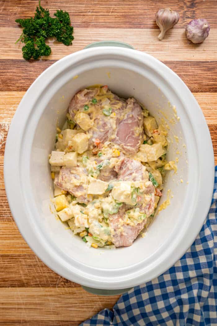 Chicken pot pie filling ingredients in a crockpot