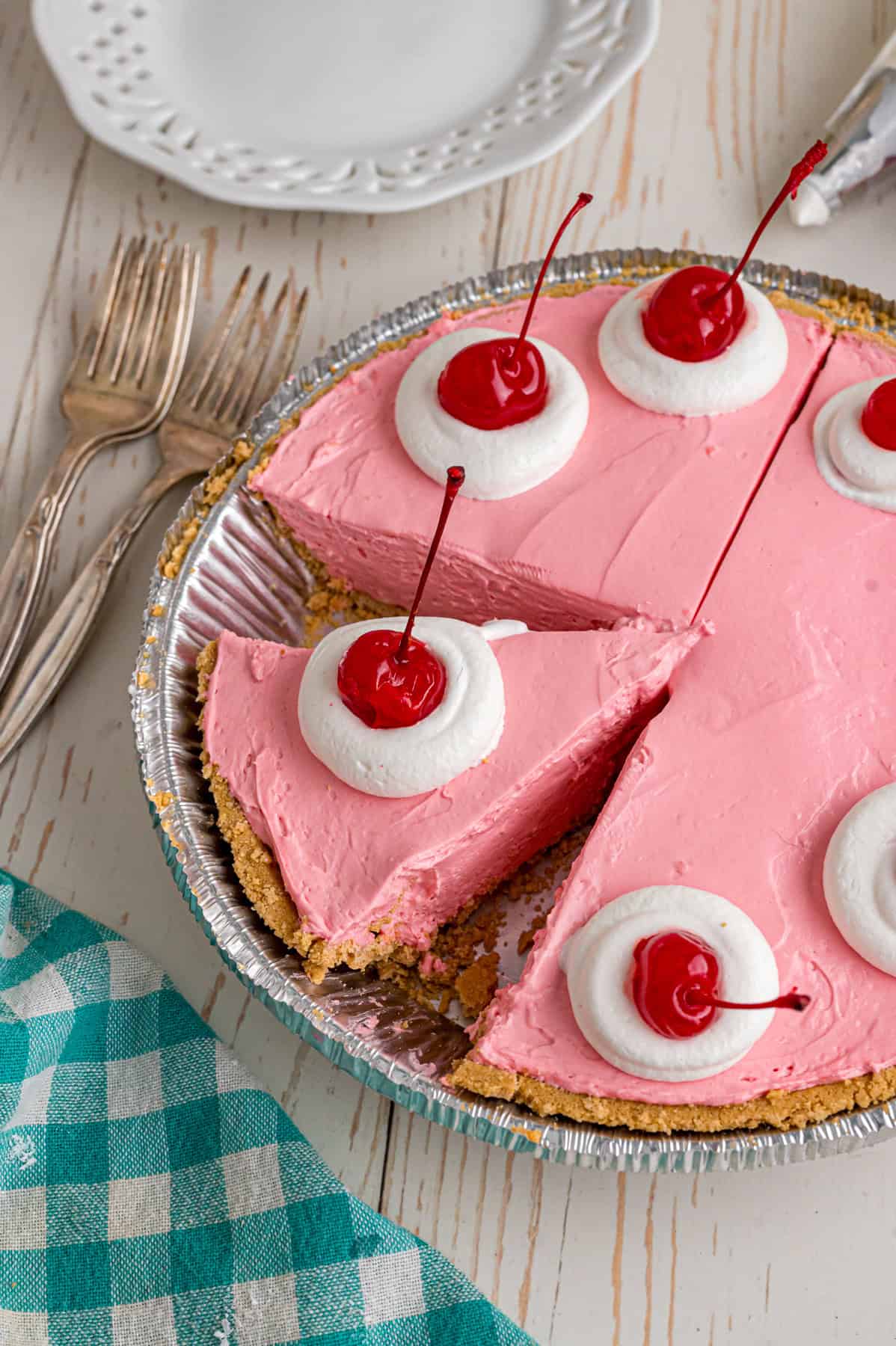 Made with cream cheese, sweetened condensed milk, and Kool Aid mix in a graham cracker crust, this No-Bake Kool Aid Pie is always a hit. A Kool Aid pie with a slice gone