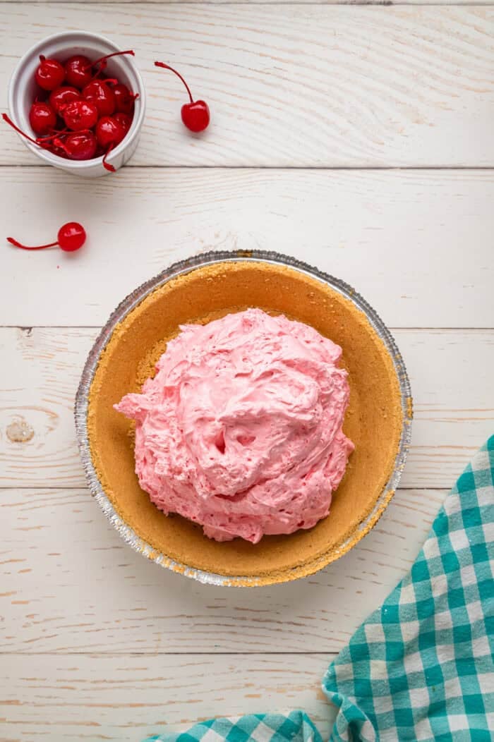 Made with cream cheese, sweetened condensed milk, and Kool Aid mix in a graham cracker crust, this No-Bake Kool Aid Pie is always a hit. Cream cheese Kool Aid filling in a graham cracker pie crust