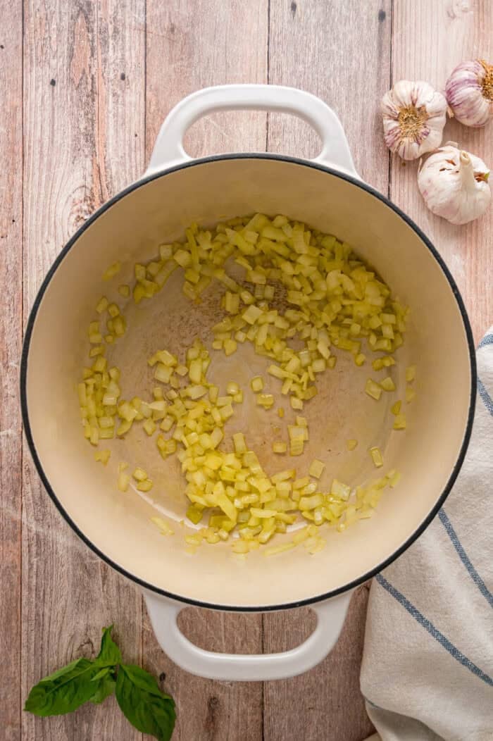 Diced onions sauteing in a pot