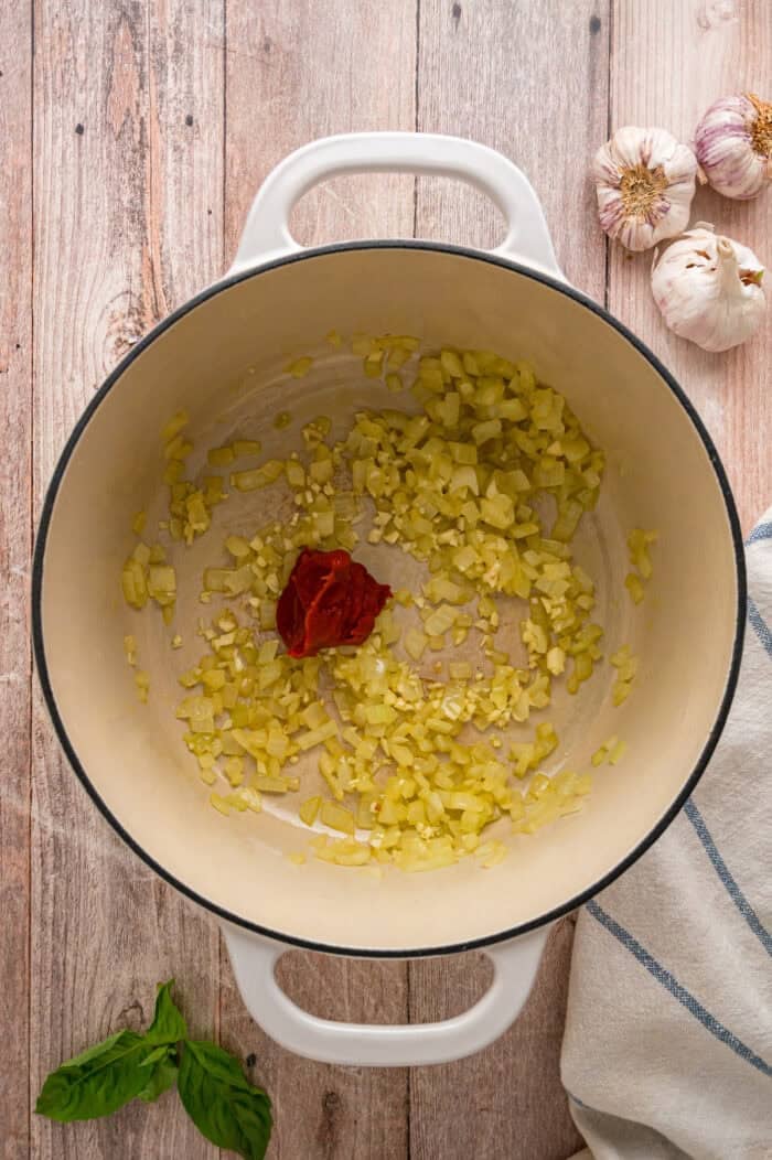 Tomato paste added to sauteed onion and garlic