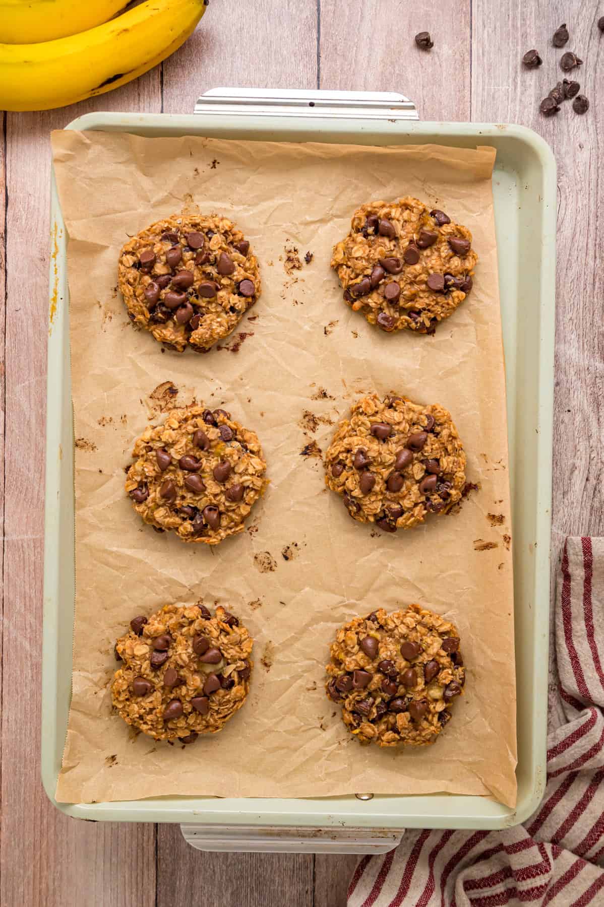 Made with just 3 ingredients in less than 25 minutes, these Banana Oatmeal Cookies are quick, easy, and so yummy. Banana oatmeal cookies on a baking sheet
