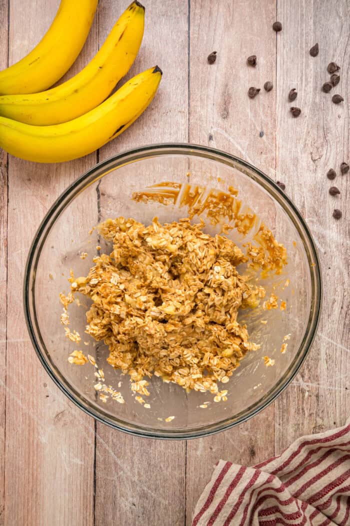 Made with just 3 ingredients in less than 25 minutes, these Banana Oatmeal Cookies are quick, easy, and so yummy. Mashed bananas, oats, and peanut butter in a bowl