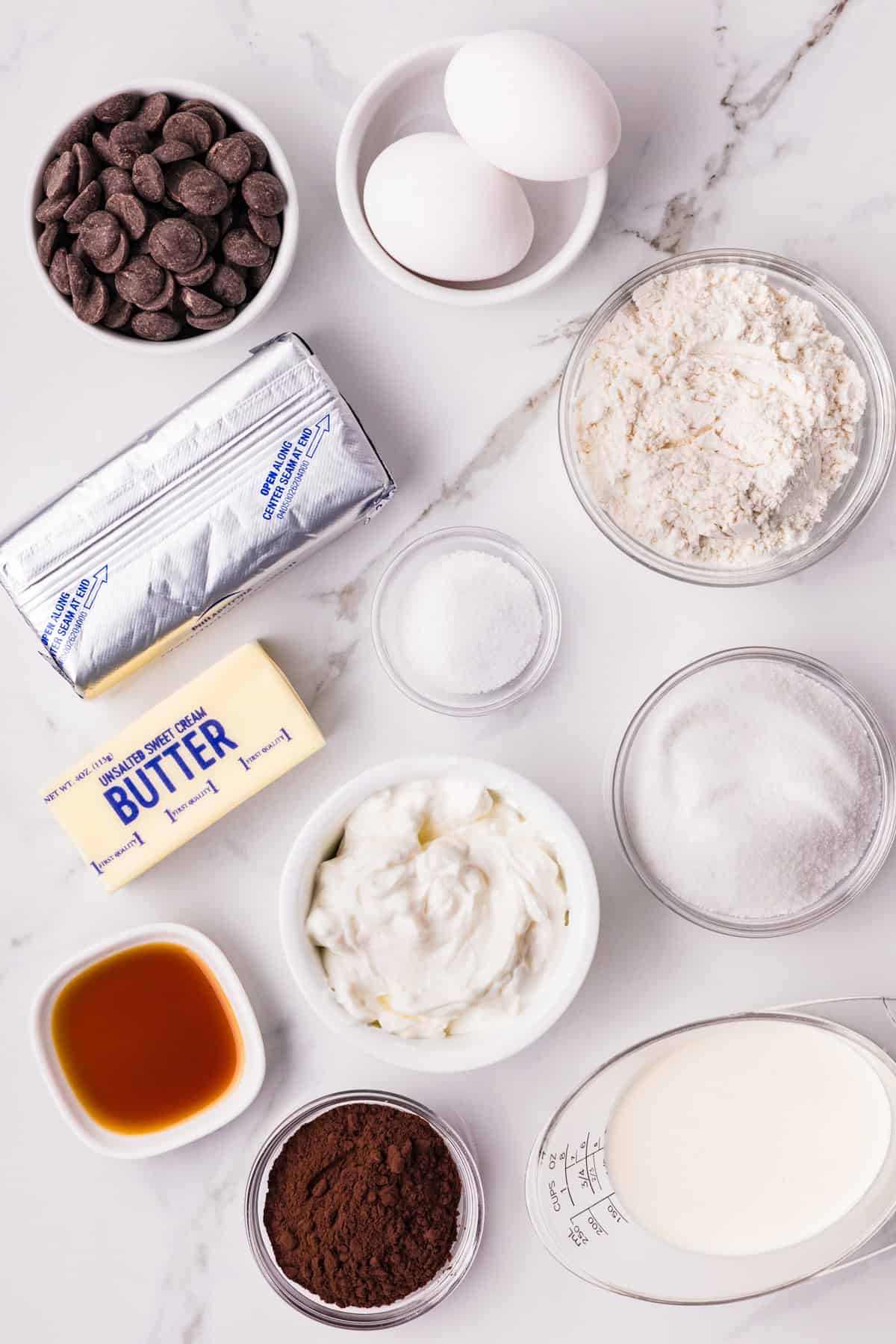 Chocolate Cheesecake Bars are ultra-decadent with three layers of chocolate. Easy to make & great for sharing! Overhead view of ingredients needed to make Chocolate Cheesecake Bars