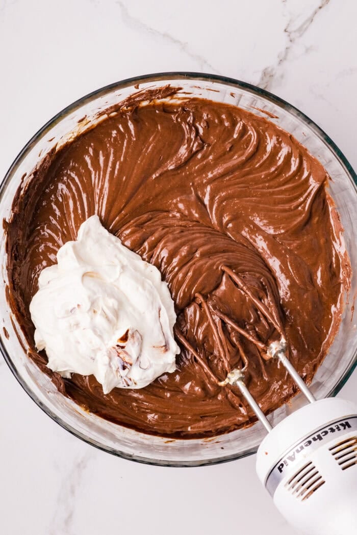 Chocolate Cheesecake Bars are ultra-decadent with three layers of chocolate. Easy to make & great for sharing! Sour cream added to chocolate cheesecake filling