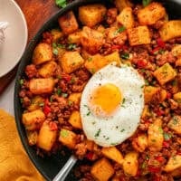 Overhead view of a skillet of chorizo and potatoes