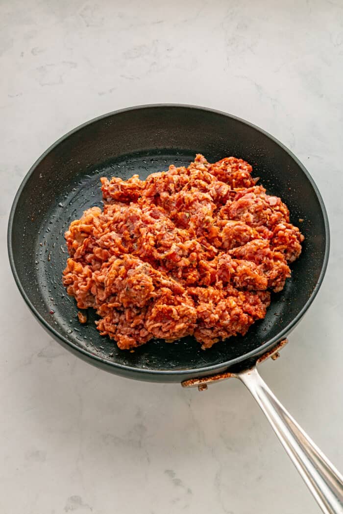 Chorizo cooking in a skillet