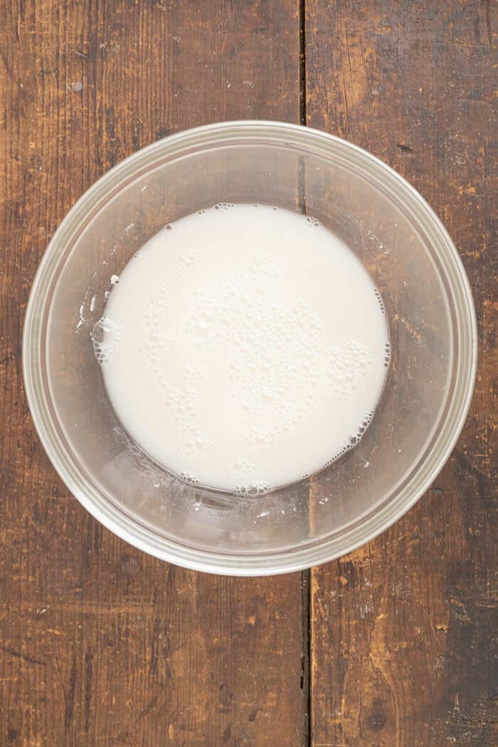 Make a crusty artisan loaf of bread at home with just 10 minutes of prep with this No Knead Dutch Oven Bread recipe. Just 4 ingredients! Yeast dissolved in water