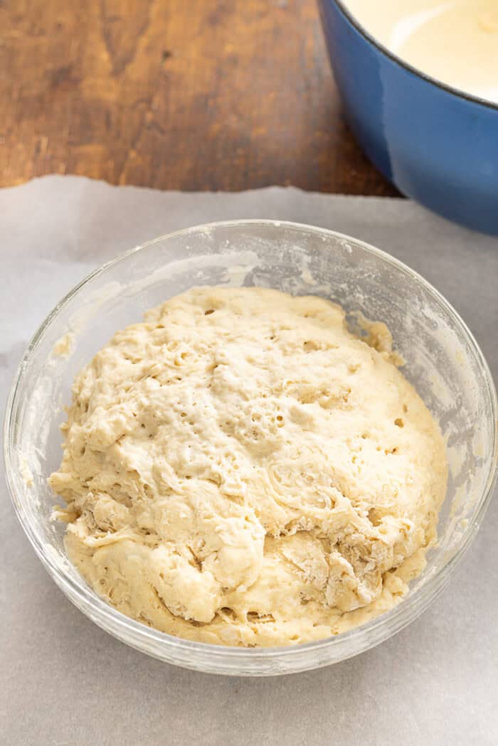 Make a crusty artisan loaf of bread at home with just 10 minutes of prep with this No Knead Dutch Oven Bread recipe. Just 4 ingredients! Bread dough after rising