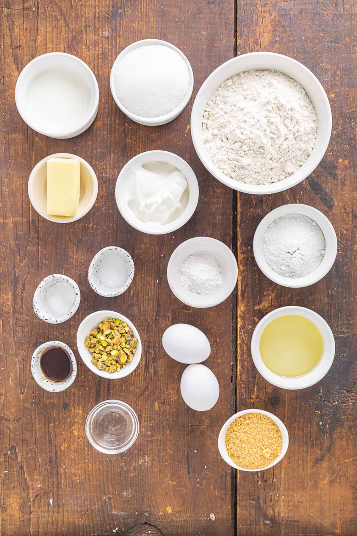 With tall bakery-style domes, these Pistachio Muffins are tender and moist with a lovely pistachio flavor. Quick & easy! Overhead view of ingredients needed to make pistachio muffins