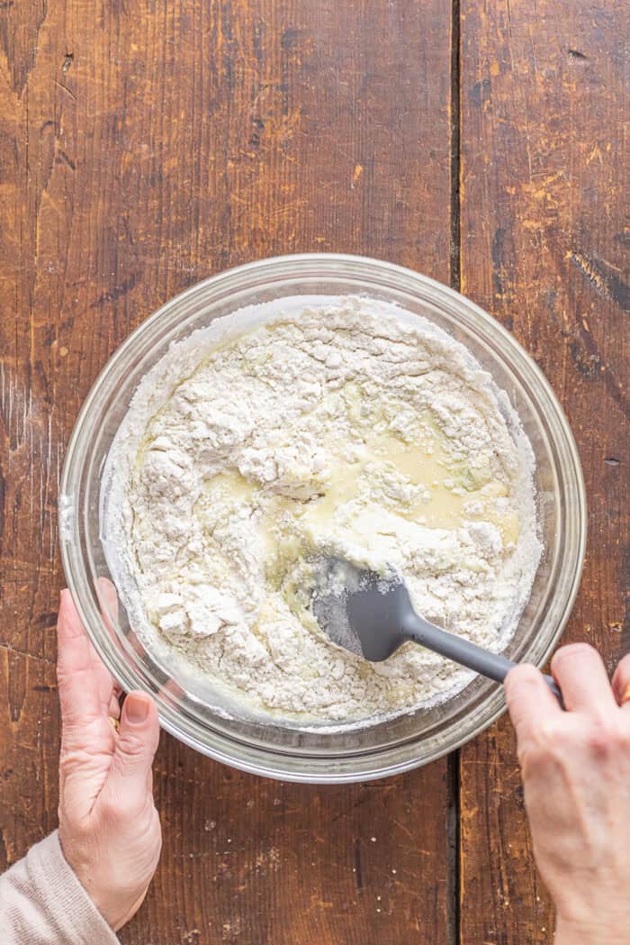 With tall bakery-style domes, these Pistachio Muffins are tender and moist with a lovely pistachio flavor. Quick & easy! Combining wet and dry muffin ingredients