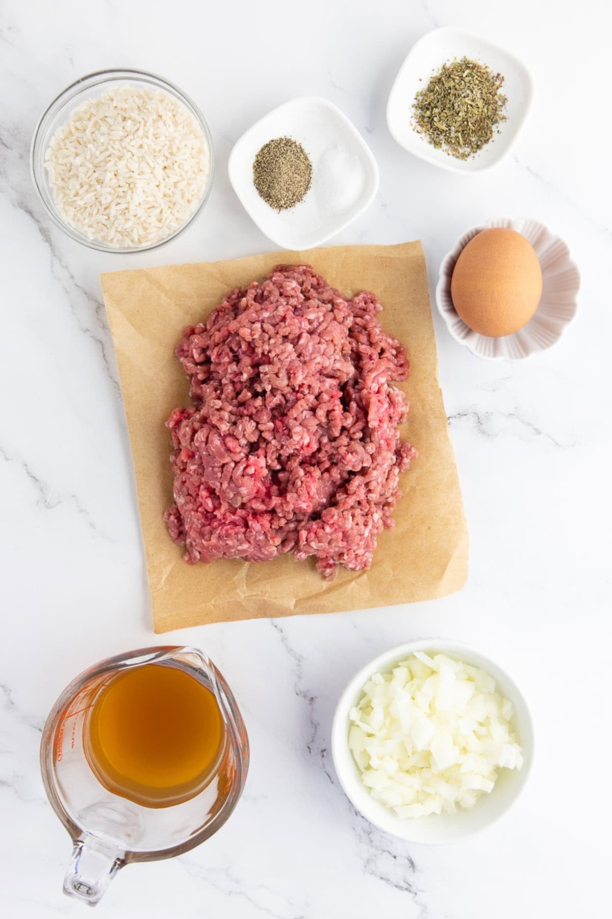 Overhead view of ingredients needed to make porcupine meatballs