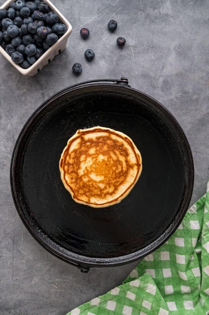Made with just a handful of ingredients, these Cottage Cheese Pancakes are soft and filling with a lightly sweet flavor. A cottage cheese pancake in a skillet