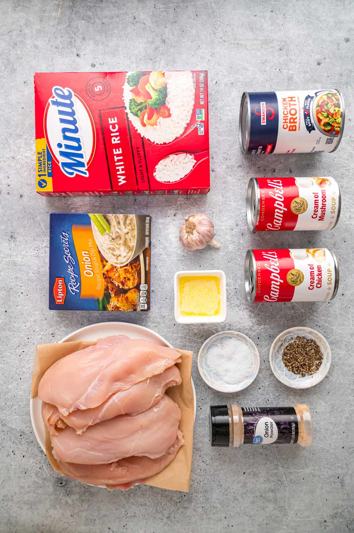 Forgotten Chicken is a classic casserole made with chicken, rice, and onion soup mix. It’s a quick & easy comfort food dinner. Overhead view of ingredients needed to make forgotten chicken