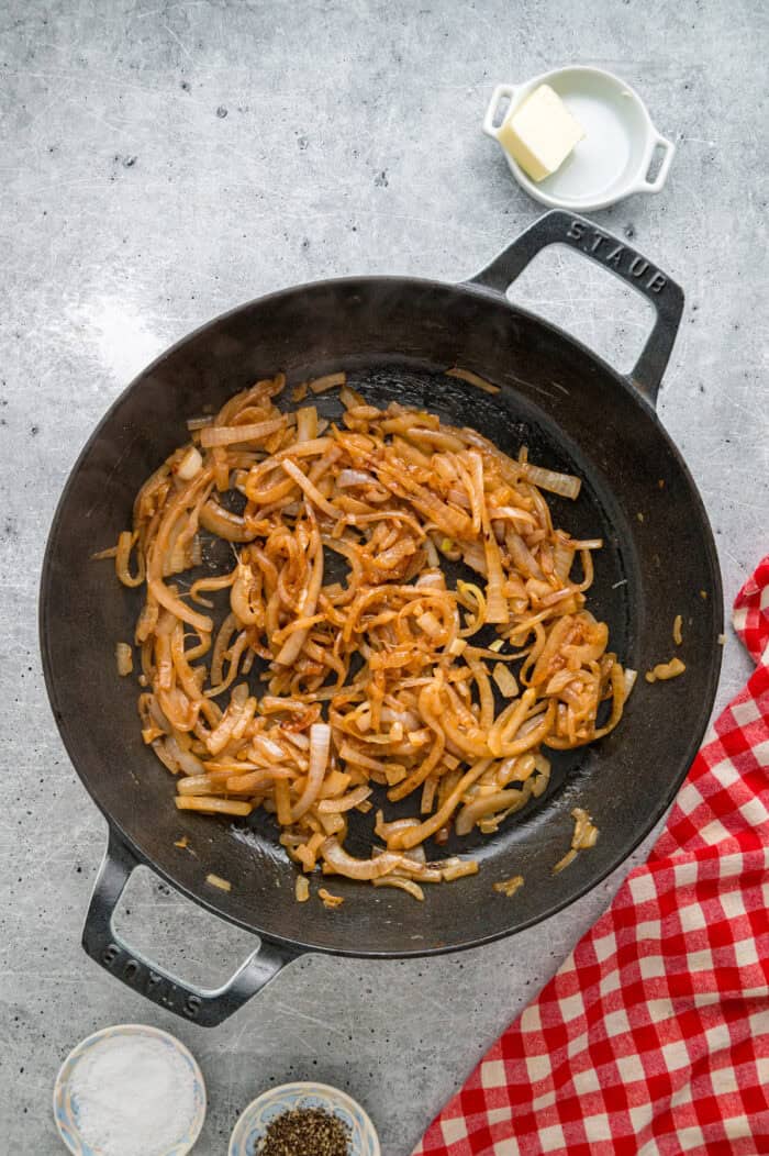 Caramelized onions, a savory onion sauce, and gooey, cheese turn basic meatloaf into an elevated dinner in this French Onion Meatloaf recipe. Caramelized onions in a skillet
