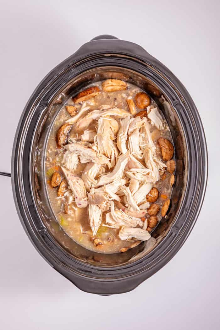 This Crock Pot Chicken Wild Rice Soup is the perfect dump & go crock pot recipe for busy weekdays. Hearty & filling. Shredded chicken added back to the crock pot
