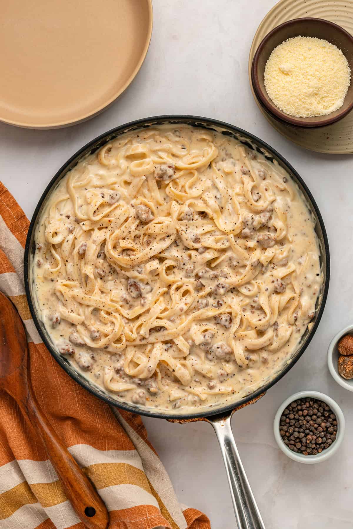 Overhead view of a skillet of ground beef alfredo
