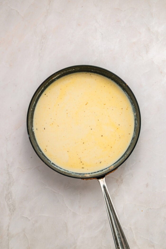 Milk and cream added to butter in the skillet