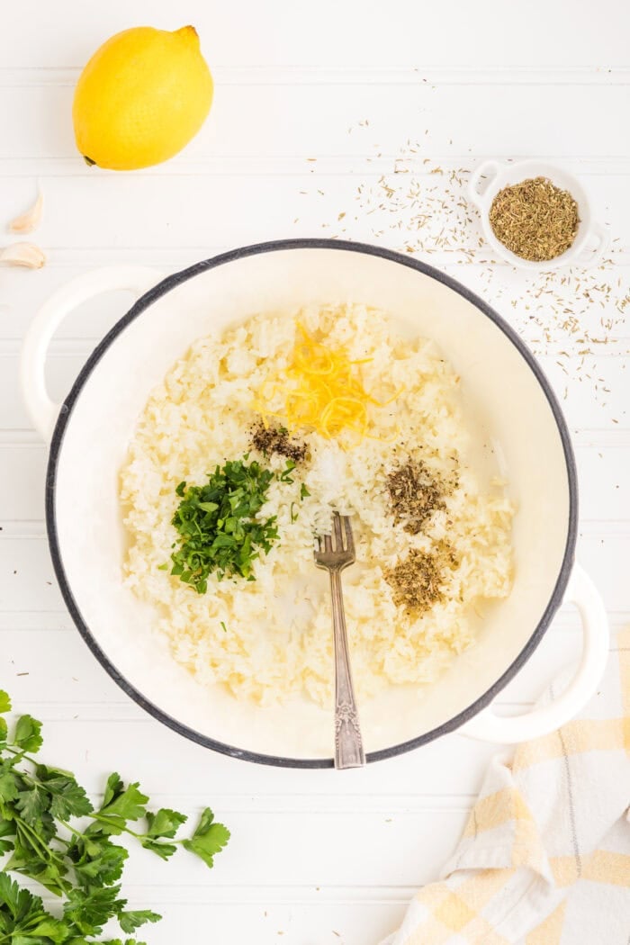 Seasonings and lemon zest added to white rice