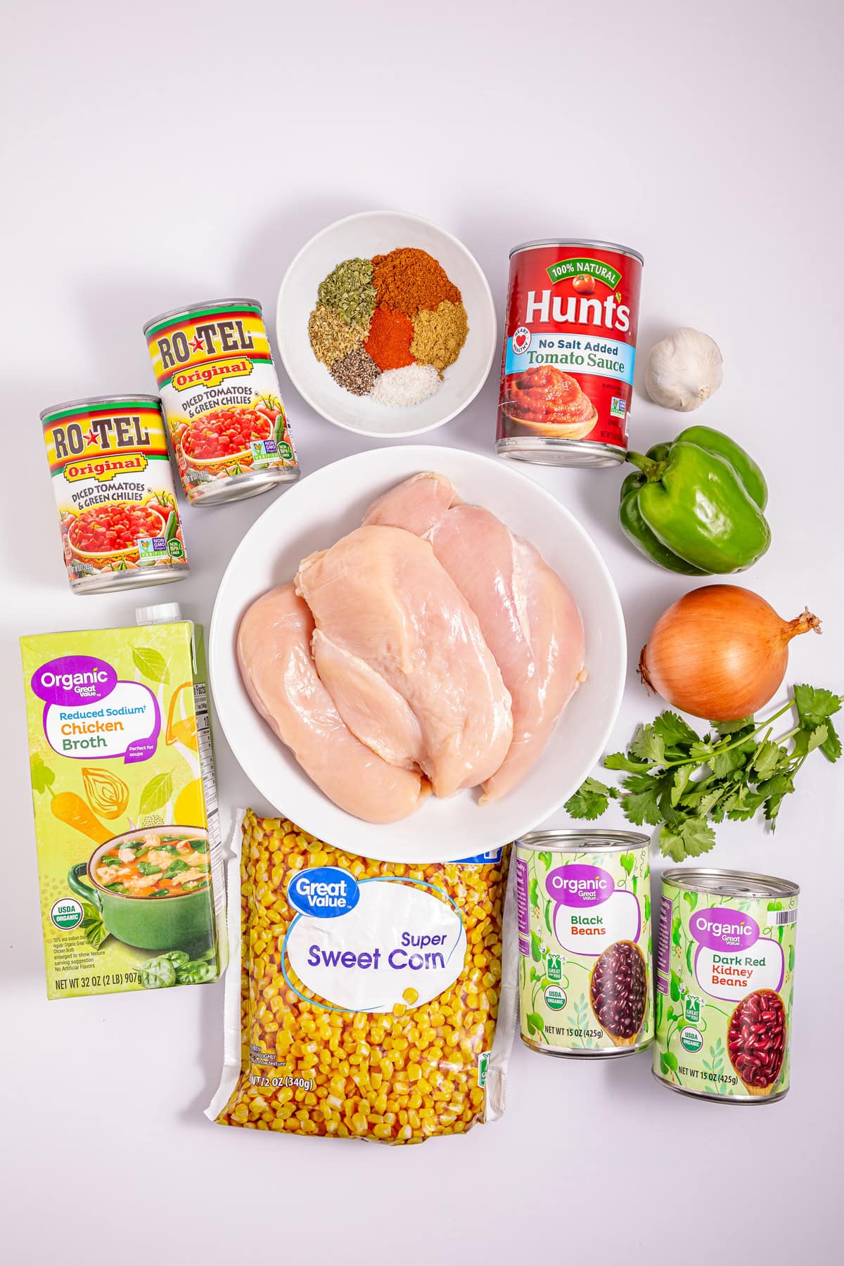 This Slow Cooker Chicken Chili is a “set it and forget it” recipe that’s perfect for busy weeknights. Hearty, filling, and super easy to make! Overhead view of ingredients needed to make slow cooker chicken chili