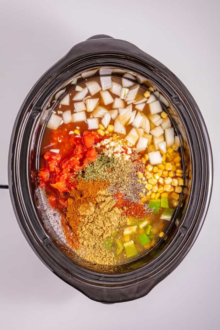 This Slow Cooker Chicken Chili is a “set it and forget it” recipe that’s perfect for busy weeknights. Hearty, filling, and super easy to make! Ingredients to make chicken chili in the slow cooker