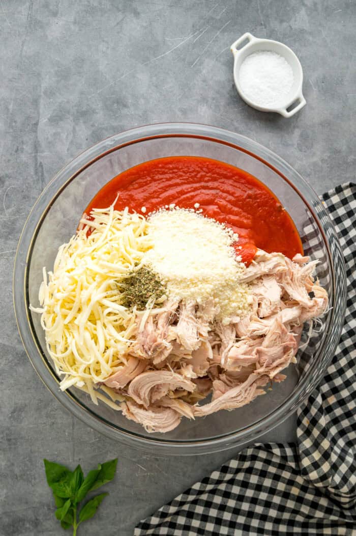 Chicken parm casserole ingredients in a bowl