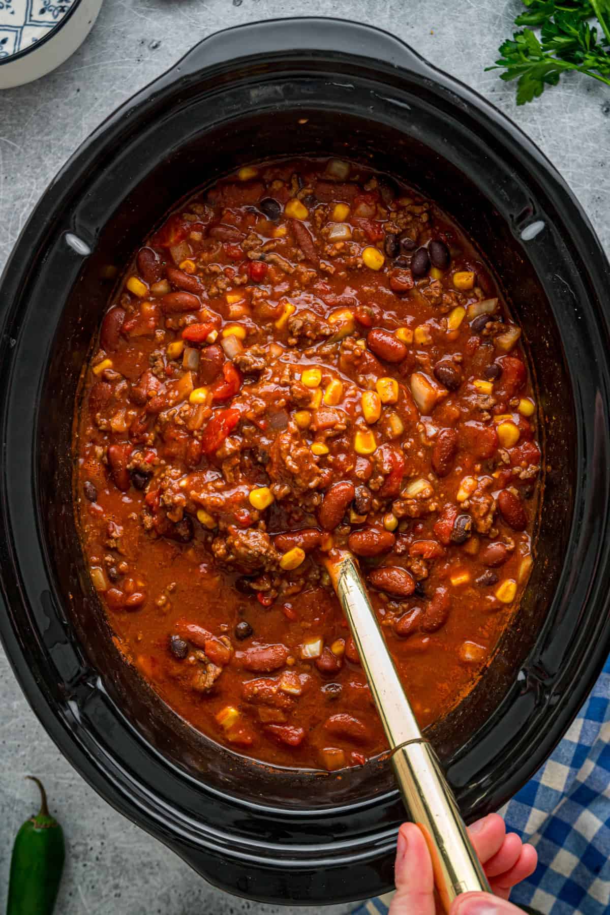 Crock Pot Chili Recipe with a Spoon