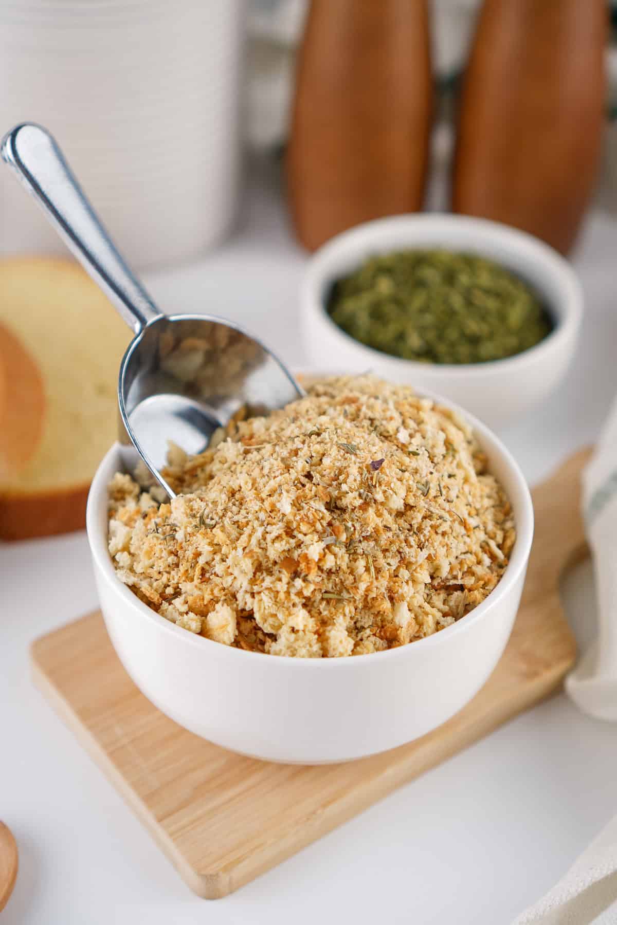 A scoop in a bowl of homemade Italian bread crumbs