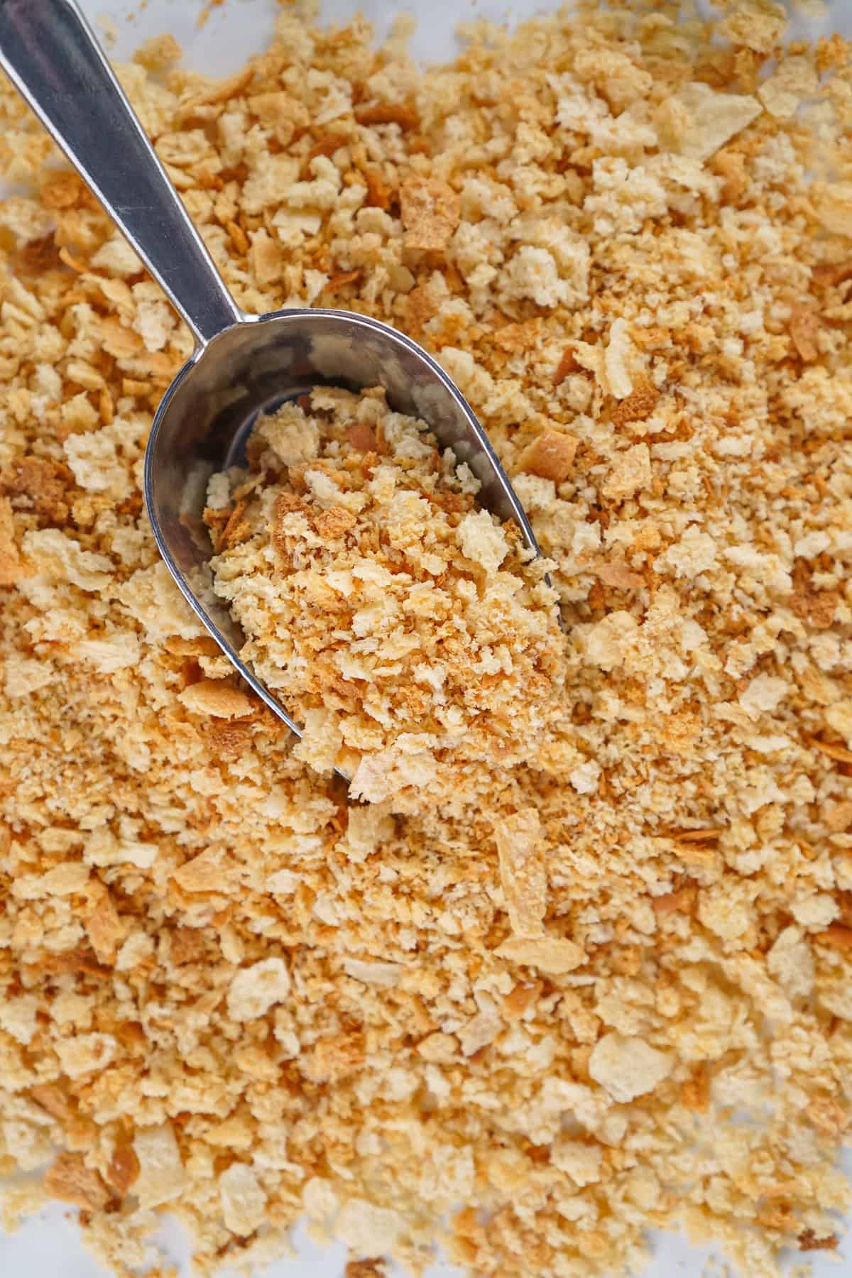 A scoop in some homemade bread crumbs
