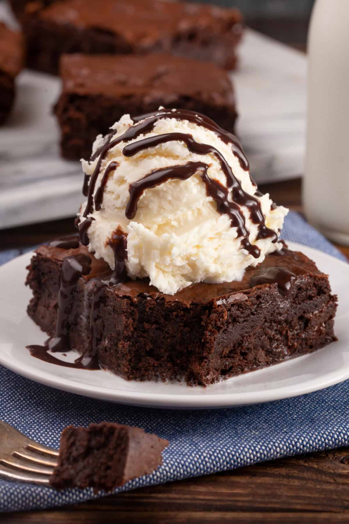 chocolate brownies made with brownie mix and altered to taste better with ice cream on top