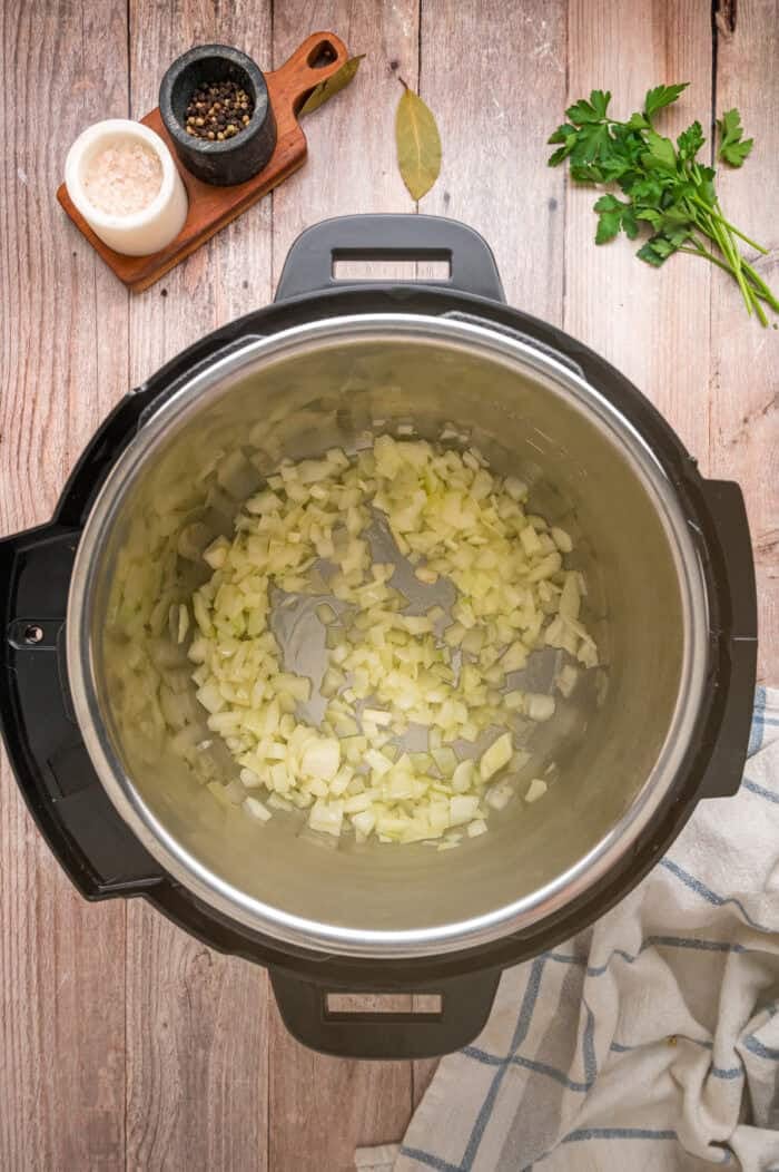 With egg noodles, shredded chicken, carrots, and celery, this Instant Pot Chicken Noodle Soup is classic comfort food made quick and easy. Diced onion in an Instant Pot