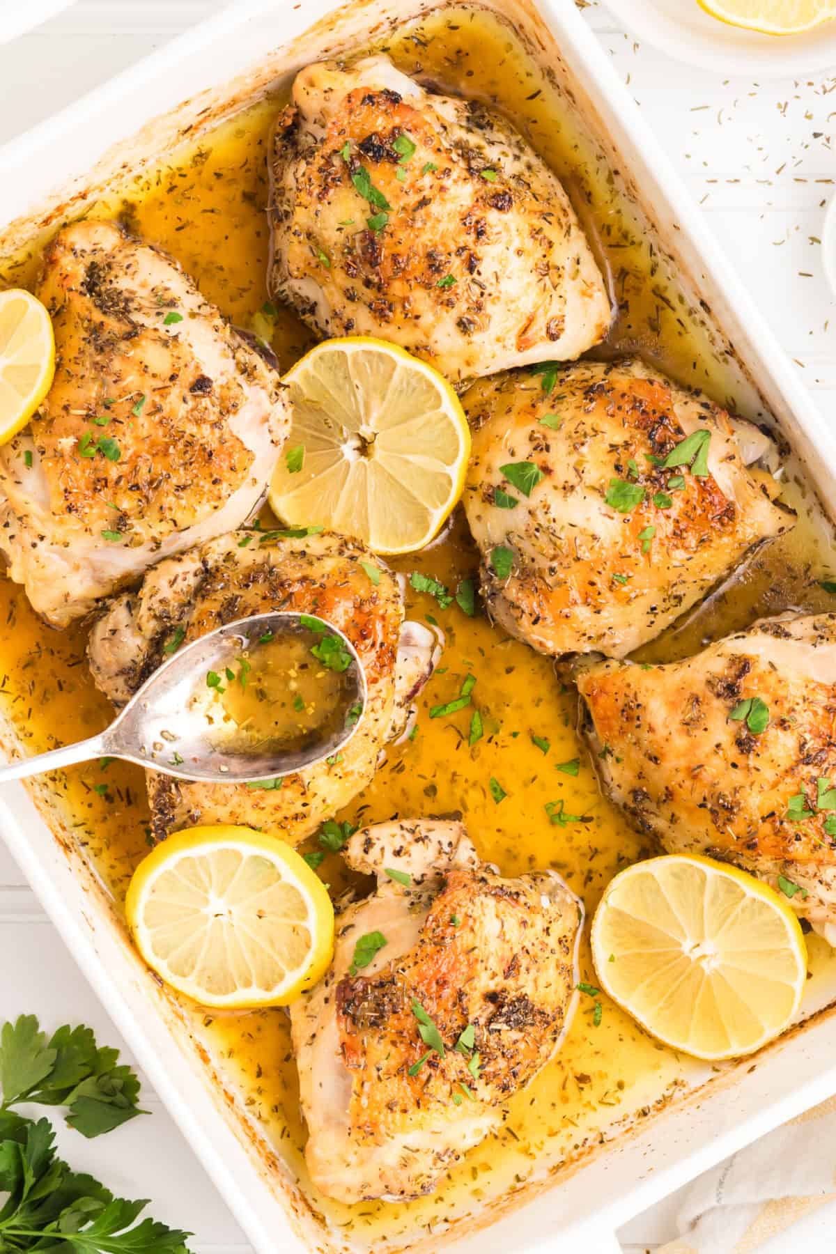 Lemon Herb Chicken Thighs baked in a pan