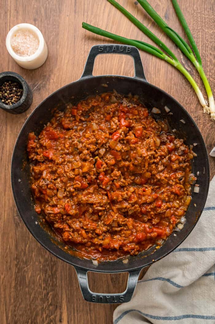 With noodles coated in sour cream, meat sauce, and lots of cheese, this sour cream noodle bake is quick, easy & comforting. Ground beef and marinara sauce in a skillet