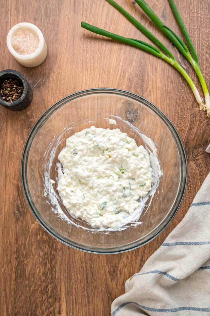 With noodles coated in sour cream, meat sauce, and lots of cheese, this sour cream noodle bake is quick, easy & comforting. A bowl of sour cream and cottage cheese