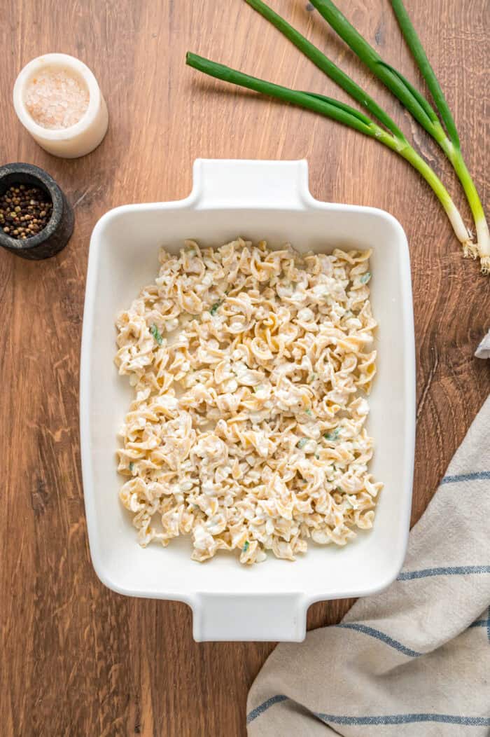 With noodles coated in sour cream, meat sauce, and lots of cheese, this sour cream noodle bake is quick, easy & comforting. Egg noodles coated with sour cream in the bottom of a pan