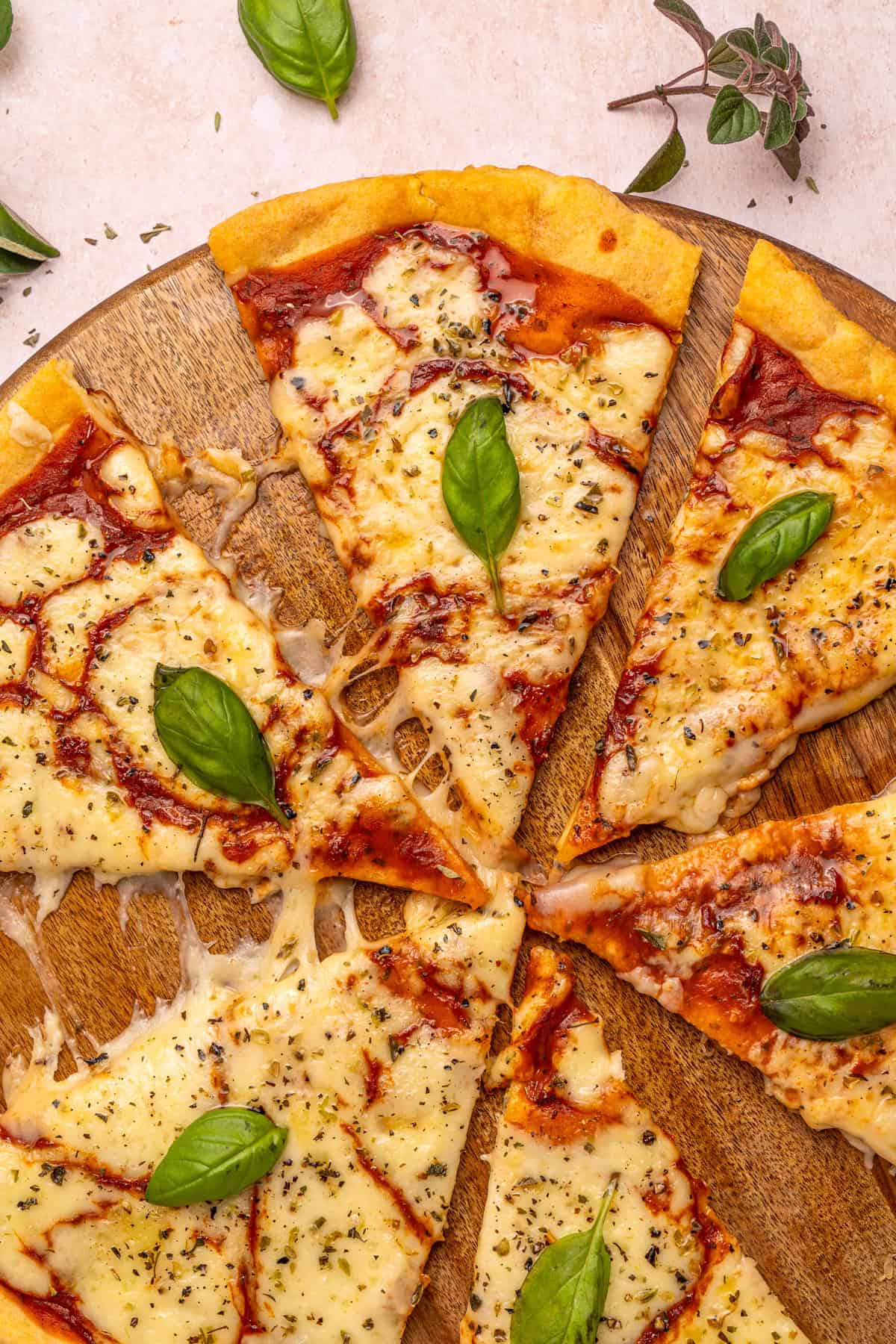 Overhead view of pizza cut into sliced