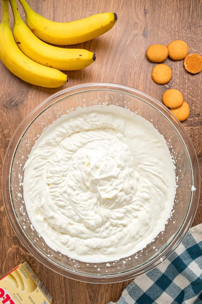 With light, airy layers of pudding, fresh banana slices, and Nilla wafers, this Magnolia Bakery Banana Pudding Recipe is an exact copycat. Homemade whipped cream in a bowl