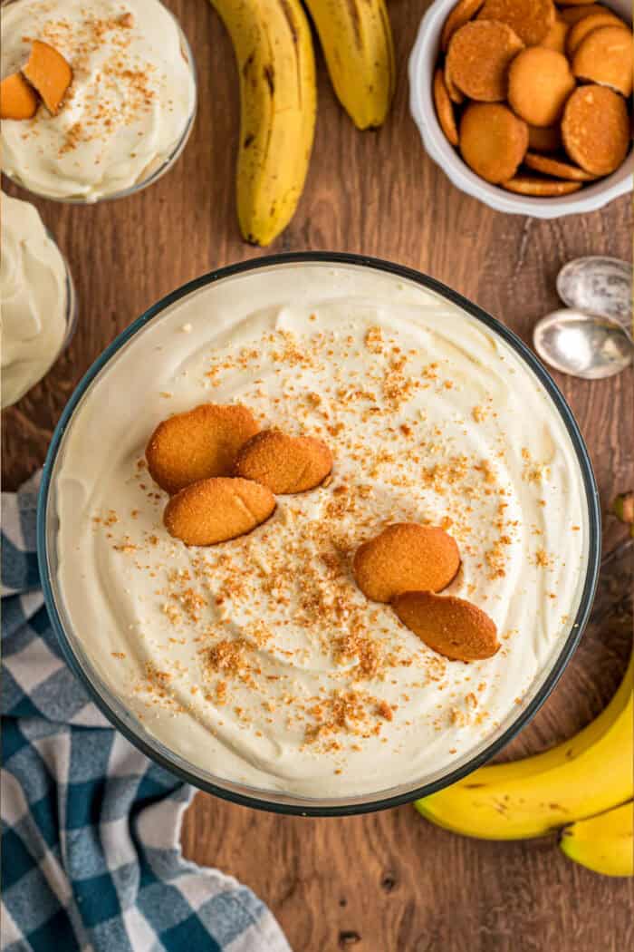 With light, airy layers of pudding, fresh banana slices, and Nilla wafers, this Magnolia Bakery Banana Pudding Recipe is an exact copycat. Top view of Magnolia Bakery Banana Pudding with vanilla wafers on top